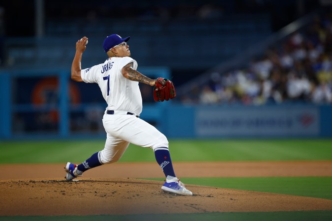 LOS ANGELES, CALIFORNIA - SEPTEMBER 01: Julio Urias #7 of the Los Angeles Dodgers throws against the Atlanta Braves in the first inning at Dodger Stadium on September 01, 2023 in Los Angeles, California. (Photo by Ronald Martinez/Getty Images)