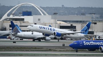 A United Airlines Boeing 737 MAX 9 airplane passes a Southwest Airlines Boeing 737 while taking off from Los Angeles International Airport (LAX) as seen from El Segundo, California, on September 11, 2023. (Photo by Patrick T. Fallon / AFP) (Photo by PATRICK T. FALLON/AFP via Getty Images)