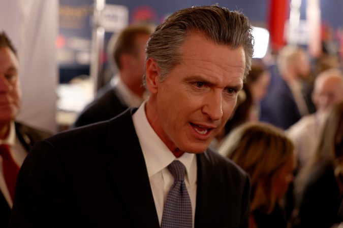 SIMI VALLEY, CALIFORNIA - SEPTEMBER 27: California Gov. Gavin Newsom talks to reporters in the spin room following the FOX Business Republican Primary Debate at the Ronald Reagan Presidential Library on September 27, 2023 in Simi Valley, California. Seven presidential hopefuls squared off in the second Republican primary debate as former U.S. President Donald Trump, currently facing indictments in four locations, declined again to participate. (Photo by Mario Tama/Getty Images)