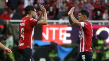 Guadalajara's forward Ricardo Marin (L) celebrates after scoring against Atlas during their Mexican Apertura tournament football match, at the Akron stadium, in Guadalajara, Jalisco State, Mexico, on October 7, 2023. (Photo by ULISES RUIZ / AFP) (Photo by ULISES RUIZ/AFP via Getty Images)