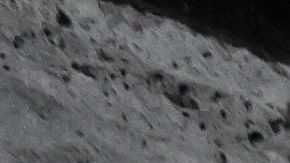 A candle and a teddy bear are seen in front of the accident scene at a residential building in Vantaa, Finland, on October 8, 2023. A fire broke out in a flat on the bottom floor of a residental block in Vantaa early on Sunday, October 8, 2023, killing five people. Four of the dead were children. (Photo by Jussi Nukari / Lehtikuva / AFP) / Finland OUT (Photo by JUSSI NUKARI/Lehtikuva/AFP via Getty Images)