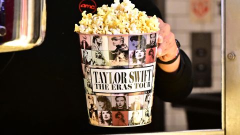 TOPSHOT - A tub of popcorn in US singer Taylor Swift's merchandise is pictured during the "Taylor Swift: The Eras Tour" concert movie world premiere at AMC Century City theatre in Century City, California on October 12, 2023. (Photo by Frederic J. BROWN / AFP) (Photo by FREDERIC J. BROWN/AFP via Getty Images)