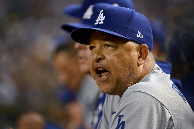 PHOENIX, ARIZONA - OCTOBER 11: Manager Dave Roberts of the Los Angeles Dodgers calls out from the dugout in the sixth inning against the Arizona Diamondbacks during Game Three of the Division Series at Chase Field on October 11, 2023 in Phoenix, Arizona. (Photo by Norm Hall/Getty Images)