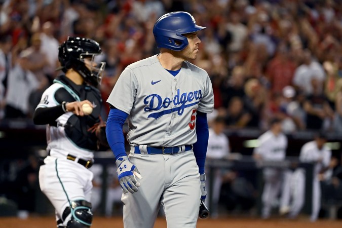 PHOENIX, ARIZONA - OCTOBER 11: Freddie Freeman #5 of the Los Angeles Dodgers walks back to the dugout after striking out in the eighth inning against the Arizona Diamondbacks during Game Three of the Division Series at Chase Field on October 11, 2023 in Phoenix, Arizona. (Photo by Norm Hall/Getty Images)