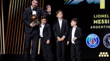 Inter Miami CF's Argentine forward Lionel Messi (L) reacts on stage with his children as he receives his 8th Ballon d'Or award during the 2023 Ballon d'Or France Football award ceremony at the Theatre du Chatelet in Paris on October 30, 2023. (Photo by FRANCK FIFE / AFP) (Photo by FRANCK FIFE/AFP via Getty Images)