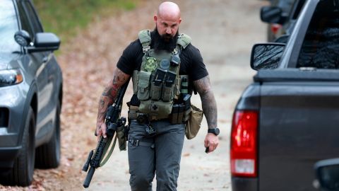 LISBON, MAINE - OCTOBER 27: A law enforcement officer helps in the manhunt for suspect Robert Card following a mass shooting on October 27, 2023 in Lisbon, Maine. Police are actively searching for a suspect, Army reservist Robert Card, who allegedly killed 18 people in a mass shooting at a bowling alley and restaurant in Lewiston, Maine. (Photo by Joe Raedle/Getty Images)