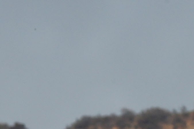 LOS ANGELES, CA - FEBRUARY 13: Visitors to the Hollywood and Highland complex view the iconic 450-foot-long Hollywood sign after activists covered it with banners during an effort to prevent the building of houses there on February 13, 2010 in Los Angeles, California. The Trust for Public Land is draped the sign in cooperation with city council member Tom LaBonge as it campaigns to raise enough funds to buy Cahuenga Peak and stop developers from purchasing the 138-acre parcel to build mansions around the Hollywood sign. A group of Chicago investors that bought the property from the estate of aircraft titan Howard Hughes in 2002 announced that they plan to subdivide the peak into luxury home sites. The land trust has raised about half the $12.5 million needed to buy the peak. They need to raise the rest by April 14. (Photo by David McNew/Getty Images)