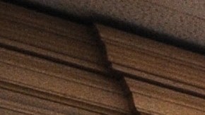 A woman stands in the doorway of a courtroom closed due to budget cuts and layoffs, at the Stanley Mosk Courthouse in downtown Los Angeles March 16, 2009. Beset by an unprecedented budget crisis, the LA Superior Court, the largest trial court system in the US, today laid of 329 employees and announced the closure of 17 courtrooms, with more of both expected in the future. AFP PHOTO / Robyn BECK (Photo credit should read ROBYN BECK/AFP via Getty Images)