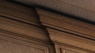 A woman stands in the doorway of a courtroom closed due to budget cuts and layoffs, at the Stanley Mosk Courthouse in downtown Los Angeles March 16, 2009. Beset by an unprecedented budget crisis, the LA Superior Court, the largest trial court system in the US, today laid of 329 employees and announced the closure of 17 courtrooms, with more of both expected in the future. AFP PHOTO / Robyn BECK (Photo credit should read ROBYN BECK/AFP via Getty Images)