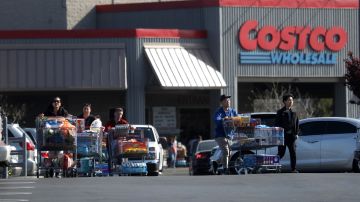 RICHMOND, CALIFORNIA - MARCH 13: Costco customers push shopping carts through the parking lot of a Costco store on March 13, 2020 in Richmond, California. Some Americans are stocking up on food, toilet paper, water and other items after the World Health Organization (WHO) declared Coronavirus (COVID-19) a pandemic. (Photo by Justin Sullivan/Getty Images)