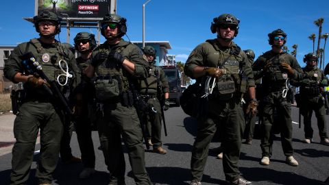 HUNTINGTON BEACH, CA - MAY 31: Huntington Beach SWAT team members stand ready for protesters after violent demonstrations in response to George Floyd's death on May 31, 2020 in Huntington Beach, California. California Governor Gavin Newsom has deployed National Guard troops to Los Angeles to curb the looting and destruction of property. Protesters have been demonstrating after video emerged of a Minneapolis police officer, Derek Chauvin, pinning Floyd's neck to the ground. Floyd was later pronounced dead while in police custody after being transported to Hennepin County Medical Center. The four officers involved in the incident have been fired and Chauvin has been arrested and charged with 3rd degree murder. (Photo by Brent Stirton/Getty Images)