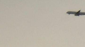 Vehicles drive on the 105 Freeway past the Los Angeles skyline at the Judge Harry Pregerson Interchange during rush hour traffic in Los Angeles, California on July 16, 2021. - The Metro C Line will eventually merge with the Crenshaw/LAX Transit Project as infrastructure modernization and transit construction projects continue at the airport ahead of the 2028 Los Angeles Olympics to reduce carbon emissions, traffic, and their impact towards climate change. (Photo by Patrick T. FALLON / AFP) (Photo by PATRICK T. FALLON/AFP via Getty Images)