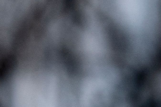 Police tape is seen in front of a police vehicle as Manuel Oliver displays a banner calling on government officials to prioritize gun violence prevention from a construction crane near the White House in Washington, DC, on February 14, 2022. Oliver's son Joaquin Oliver was killed in the Parkland School shooting four years ago today. (Photo by Stefani Reynolds / AFP) (Photo by STEFANI REYNOLDS/AFP via Getty Images)