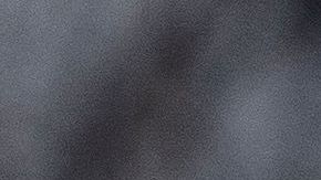 Police tape is seen in front of a police vehicle as Manuel Oliver displays a banner calling on government officials to prioritize gun violence prevention from a construction crane near the White House in Washington, DC, on February 14, 2022. Oliver's son Joaquin Oliver was killed in the Parkland School shooting four years ago today. (Photo by Stefani Reynolds / AFP) (Photo by STEFANI REYNOLDS/AFP via Getty Images)