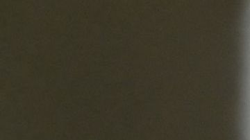 A man remains handcuffed after being detained by the police during an operation against gang members in Soyapango, El Salvador, on December 3, 2022. - Around 10,000 Salvadoran army troops and police officers surrounded the populous city of Soyapango, on the outskirts of capital San Salvador, as the government stepped up its fight against criminal gangs, President Nayib Bukele announced Saturday. (Photo by Marvin RECINOS / AFP) (Photo by MARVIN RECINOS/AFP via Getty Images)