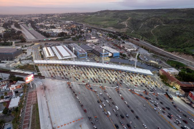 Aerial view of San Ysidro crossing port at the US-Mexico border seen from Tijuana, Baja California State, Mexico, on January 9, 2023. - US President Joe Biden is in Mexico City for a regional summit with the leaders of Mexico and Canada, where border and regional migration problems were also set to be at the top of the agenda. (Photo by Guillermo ARIAS / AFP) (Photo by GUILLERMO ARIAS/AFP via Getty Images)