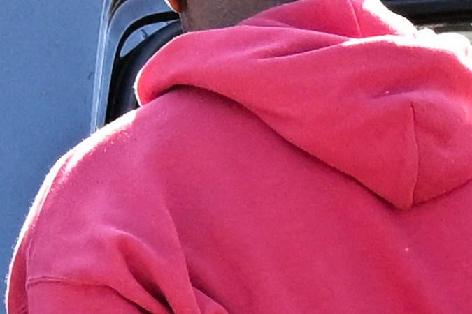 A Los Angeles Police Department (LAPD) officer wears an Axon body camera (R) as a Black driver is handcuffed and placed into a patrol car during a traffic stop by officers on Crenshaw Blvd in Los Angeles, California on January 31, 2023. (Photo by Patrick T. Fallon / AFP) (Photo by PATRICK T. FALLON/AFP via Getty Images)
