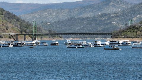 Boats are parked in front of the Bidwell Bar Bridge on a filled Lake Oroville in Oroville, California, on April 16, 2023. - A very wet winter has left California's reservoirs looking healthier than they have for years, as near-record rainfall put a big dent in a lengthy drought. A series of atmospheric rivers -- high altitude ribbons of moisture -- chugged into the western United States, dousing a landscape that had been baked dry by years of below-average rain. (Photo by JOSH EDELSON / AFP) (Photo by JOSH EDELSON/AFP via Getty Images)