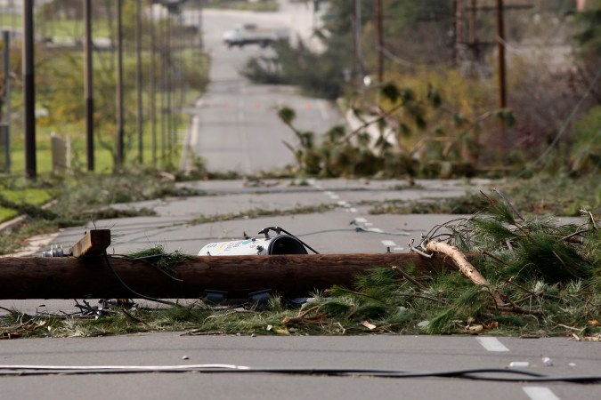 PASADENA, CA - DECEMBER 1: Fallen power poles block a street as strong Santa Ana Winds cause the worst local wind damage in decades on December 1, 2011 in Pasadena, California. As many as 230,000 were without power and the city of Pasadena closed schools and declared a state of emergency. (Photo by David McNew/Getty Images)