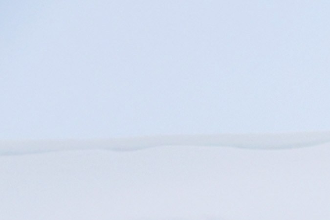 MAMMOTH LAKES, CALIFORNIA - MARCH 29: A person removes snow in front of lodging obscured by snowbanks piled up from new and past storms in the Sierra Nevada mountains, after yet another storm system brought heavy snowfall further raising the snowpack on March 29, 2023 in Mammoth Lakes, California. The Pacific storm delivered widespread rain and mountain snow to the U.S. west coast in Northern California and Oregon. After years of drought, the state snowpack average for California may hit an all time record from the several feet of new snow which fell during the storm in parts of the Sierra Nevada mountains. Nearby Mammoth Mountain ski resort announced today it has received the highest amount of total snow at the Main Lodge for any season, with 695 total inches, after at least 28 inches of new snow fell during the storm. (Photo by Mario Tama/Getty Images)