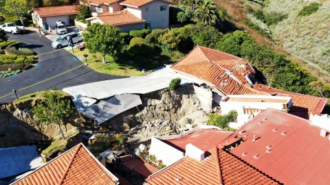 ROLLING HILLS ESTATES, CALIFORNIA - JULY 11: An aerial view of upscale homes destroyed by a landslide on Palos Verdes Peninsula on July 11, 2023 in Rolling Hills Estates, California. The still unexplained landslide destroyed 12 homes over the weekend and has sent ten of the homes slowly sliding toward a canyon below, forcing the City Council to declare a local state of emergency. (Photo by Mario Tama/Getty Images)