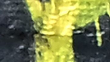 A pedestrian walks past a man sleeping on a Skid Row sidewalk on August 16, 2023 in Los Angeles, California, where homelessness has seen a 10 percent surge compared to last year. A recent report from the Los Angeles Homeless Services Authority reveals an estimate of 42,260 people living on the streets of Los Angeles without shelter, as the homeless population has more than doubled over the past decade. (Photo by Frederic J. BROWN / AFP) (Photo by FREDERIC J. BROWN/AFP via Getty Images)