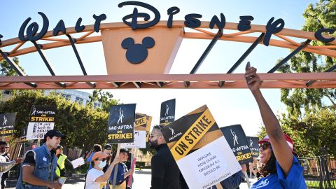 SAG-AFTRA members and supporters picket outside Disney Studios on day 111 of their strike against the Hollywood studios, in Burbank, California, on November 1, 2023. SAG-AFTRA members walked off film and TV sets in July, over terms including pay and the use of artificial intelligence. Talks have intensified in recent weeks, with the two sides meeting most days and expressing cautious optimism -- while also warning that they remain far apart on several key issues. (Photo by Frederic J. BROWN / AFP) (Photo by FREDERIC J. BROWN/AFP via Getty Images)