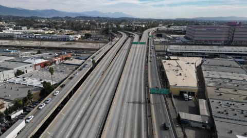 An aerial view shows an empty Interstate-10 freeway, also called the Santa Monica Freeway, in Los Angeles, California, on November 13, 2023, after a large pallet fire burned the area on November 11, 2023. California Governor Gavin Newsom has declared a state of emergency as the busy freeway is closed indefinitely while infrastructure officials assess whether the structural integrity of the freeway has been compromised. (Photo by Robyn Beck / AFP) (Photo by ROBYN BECK/AFP via Getty Images)