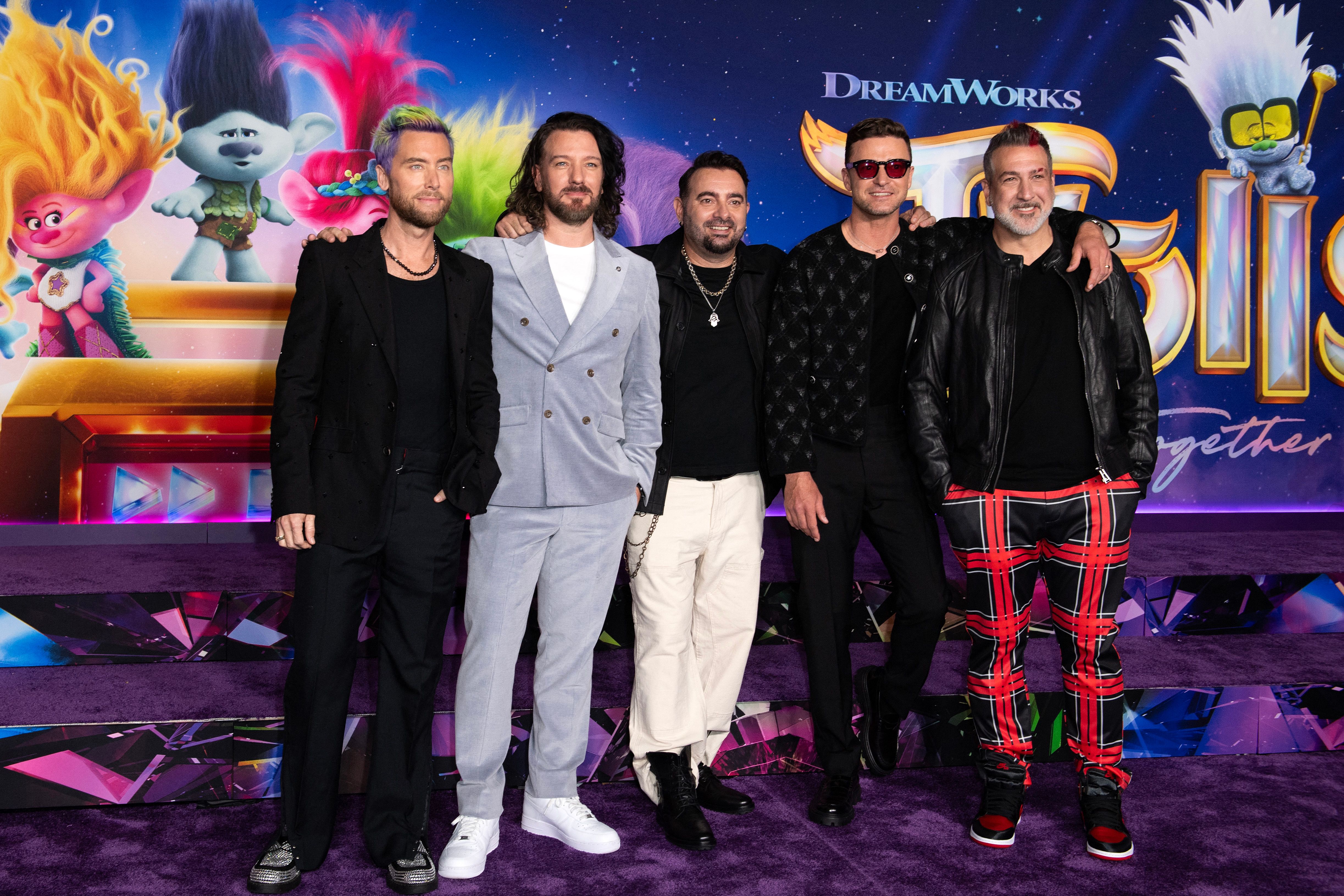 (From L) US singers Lance Bass, JC Chasez, Chris Kirkpatrick, Justin Timberlake, and Joey Fatone of boy band NSYNC arrive for the premiere of "Trolls: Band Together" at the TCL Chinese Theater in Hollywood, California, on November 15, 2023. (Photo by VALERIE MACON / AFP) (Photo by VALERIE MACON/AFP via Getty Images)