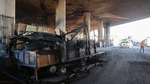 LOS ANGELES, CALIFORNIA - NOVEMBER 13: Fire damage is viewed beneath the closed I-10 elevated freeway following a large pallet fire, which occurred Saturday at a storage yard beneath the freeway, on November 13, 2023 in Los Angeles, California. Engineers have been assessing the extent of the damage and it remains unknown how long the freeway, which is a major commuter artery through the downtown area, will remain closed and complicate traffic for the city. California Governor Gavin Newsom said the fire was caused by arson and that over 300,000 vehicles drive through the freeway corridor each day with drivers being urged to use public transit. (Photo by Mario Tama/Getty Images)