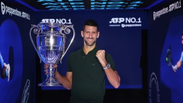 TURIN, ITALY - NOVEMBER 13: Novak Djokovic of Serbia with the ATP Year End World Number One Trophy and remains The World Number One for a record 400 weeks (as of Monday 20th November) during day two of the Nitto ATP Finals at Pala Alpitour on November 13, 2023 in Turin, Italy. (Photo by Clive Brunskill/Getty Images)