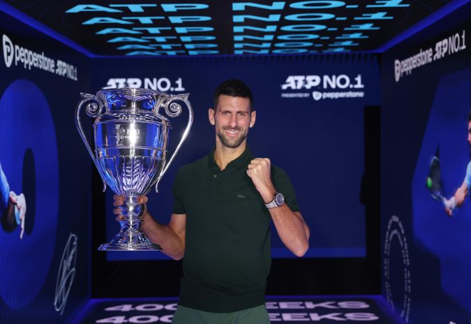 TURIN, ITALY - NOVEMBER 13: Novak Djokovic of Serbia with the ATP Year End World Number One Trophy and remains The World Number One for a record 400 weeks (as of Monday 20th November) during day two of the Nitto ATP Finals at Pala Alpitour on November 13, 2023 in Turin, Italy. (Photo by Clive Brunskill/Getty Images)