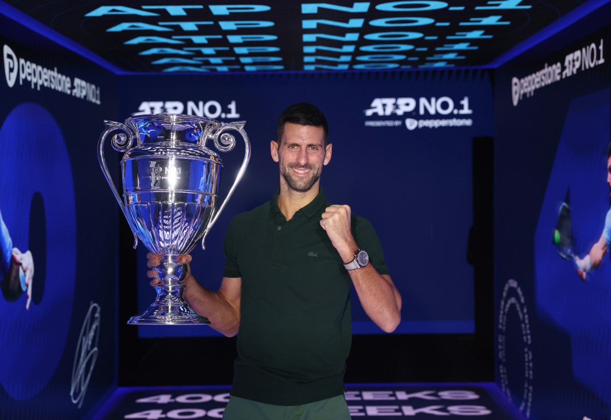 TURIN, ITALY - NOVEMBER 13:  Novak Djokovic of Serbia with the ATP Year End World Number One Trophy and remains The World Number One for a record 400 weeks (as of Monday 20th November) during day two of the Nitto ATP Finals at Pala Alpitour on November 13, 2023 in Turin, Italy. (Photo by Clive Brunskill/Getty Images)
