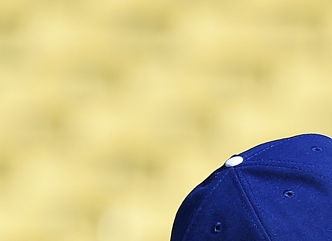 LOS ANGELES, CALIFORNIA - OCTOBER 09: Mookie Betts #50, Freddie Freeman #5 and Max Muncy #13 of the Los Angeles Dodgers wait in the dugout before the start of Game Two of the Division Series against the Arizona Diamondbacks at Dodger Stadium on October 09, 2023 in Los Angeles, California. (Photo by Harry How/Getty Images)