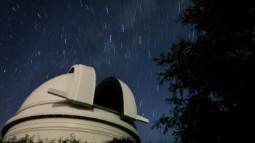 PALOMAR MTN, CA - AUGUST 28: View of the Palomar Observatory at night, on August 28, 2006, outside of San Diego, California. Scientists at the obsevatory were instrumental in determining that Pluto be downgraded to a dwarf planet. (Photo by Sandy Huffaker/Getty Images)
