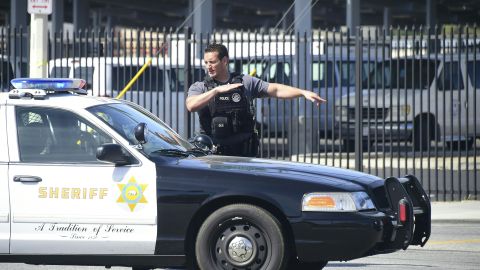 Police man an intersection May 11, 2018 following reports of shooting at Highland High School in Palmdale, 40 miles (65 kilometers) north of downtown Los Angeles. - Police arrested a man after reports of shootings at two schools near Los Angeles, the local sheriff's department and education officials said. The Los Angeles County Sheriff said one suspect had been detained "regarding the person with a gun" at Highland High School. Local news reports had earlier said that at least one person had been wounded. It was not immediately clear what type of weapon the man had. (Photo by Frederic J. BROWN / AFP) (Photo credit should read FREDERIC J. BROWN/AFP via Getty Images)