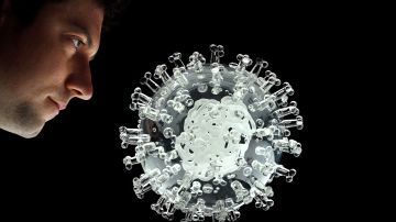 TOPSHOT - A glass sculpture entitled "coronavirus COVID-19" created by British artist Luke Jerram is seen at his studio in Bristol, southwest of England on March 17, 2020. - Jerram has created a coronavirus COVID-19 glass sculpture in tribute to the huge global scientific and medical effort to combat the pandemic. Made in glass, at 23cm in diameter, it is 1 million times larger than the actual virus. - RESTRICTED TO EDITORIAL USE - MANDATORY MENTION OF THE ARTIST UPON PUBLICATION - TO ILLUSTRATE THE EVENT AS SPECIFIED IN THE CAPTION (Photo by ADRIAN DENNIS / AFP) / RESTRICTED TO EDITORIAL USE - MANDATORY MENTION OF THE ARTIST UPON PUBLICATION - TO ILLUSTRATE THE EVENT AS SPECIFIED IN THE CAPTION / RESTRICTED TO EDITORIAL USE - MANDATORY MENTION OF THE ARTIST UPON PUBLICATION - TO ILLUSTRATE THE EVENT AS SPECIFIED IN THE CAPTION (Photo by ADRIAN DENNIS/AFP via Getty Images)