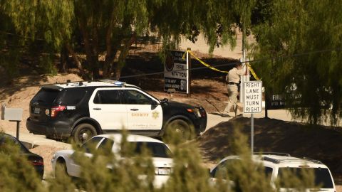 A Los Angeles County Sheriff department vehicle is seen near police tape outside LA County Fire Station 81 after a shooting there left one firefighter dead, in Agua Dulce, California on June 1, 2021. - A shooting at a fire station in Agua Dulce on the morning of June 1 left one firefighter dead and another wounded, officials said. (Photo by Patrick T. FALLON / AFP) (Photo by PATRICK T. FALLON/AFP via Getty Images)