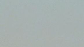 Snow-capped mountains are seen in the distance behind the downtown skyline on March 2, 2023 in Los Angeles, California where a new cold system brought hail and snow to unusually low elevations for the mountains in Southern California. (Photo by Frederic J. BROWN / AFP) (Photo by FREDERIC J. BROWN/AFP via Getty Images)