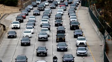 LOS ANGELES, CALIFORNIA - APRIL 22: Vehicles make their way down the aging 110 freeway toward downtown L.A. during the morning commute on April 22, 2021 in Los Angeles, California. President Joe Biden pledged to cut U.S. greenhouse gas emissions in half by 2030 at the Earth Day climate summit. (Photo by Mario Tama/Getty Images)