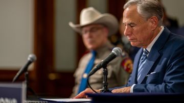 AUSTIN, TEXAS - JUNE 08: Texas Gov. Greg Abbott glances over a bill before signing during a news conference at the state Capitol on June 08, 2023 in Austin, Texas. Abbott and Texas Department of Public Safety Director Steve McCraw joined bill authors, sponsors, legislators and law enforcement members in the signing of bills aimed at enhancing southern border security. (Photo by Brandon Bell/Getty Images)