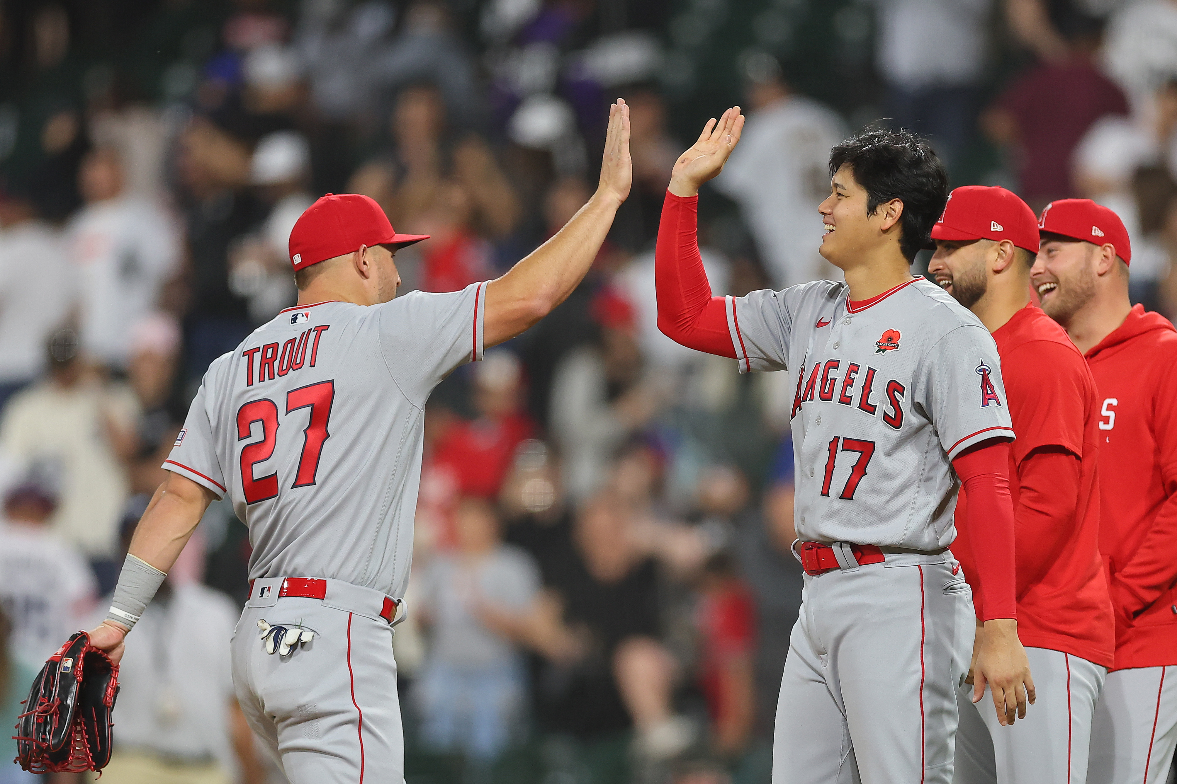 CHICAGO, ILLINOIS - MAY 29: Mike Trout #27 and Shohei Ohtani #17 of the Los Angeles Angels high five after defeating the Chicago White Sox at Guaranteed Rate Field on May 29, 2023 in Chicago, Illinois. (Photo by Michael Reaves/Getty Images)