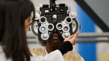 LOS ANGELES, CA - SEPTEMBER 27: An eye examination is performed as part of a free health care service at the Care Harbor clinic at the Los Angeles Sports Arena on September 27, 2012 in Los Angeles, California. Care Harbor is expected to give free medical, dental and vision care to 4,800 uninsured patients at the event, which runs from September 27-30. In Los Angeles County it is reported that 2.2 million people do not have health insurance, which includes an estimated 227,000 young and school-aged children. (Photo by Kevork Djansezian/Getty Images)