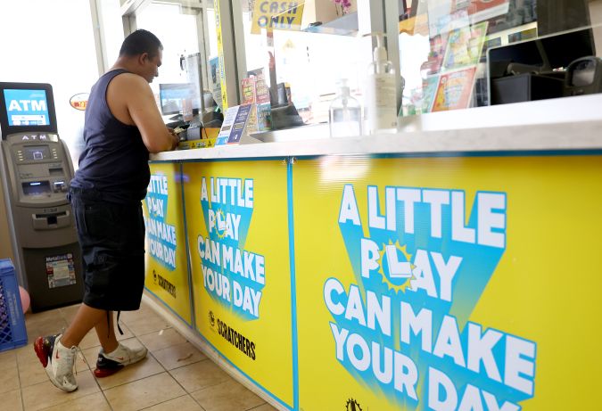 LOS ANGELES, CALIFORNIA - JULY 20: A customer stands in the Las Palmitas Mini Market on July 20, 2023 in Los Angeles California. The $1.08 billion winning Powerball ticket was sold at the Las Palmitas Mini Market for the July 19th drawing. The jackpot is the third largest in Powerball history and was picked after three months of drawings without a winner. The mini market is located in the downtown Fashion District close to Skid Row. (Photo by Mario Tama/Getty Images)