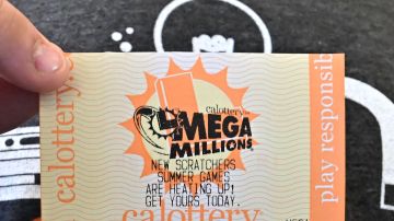 A Mega Millions lottery ticket is displayed in Los Angeles, California, on August 4, 2023. The sixth-largest jackpot in US history is up for grabs tonight after no tickets have been sold with all six numbers in the multi-state Mega Millions game for 30 consecutive draws. (Photo by Frederic J. BROWN / AFP) (Photo by FREDERIC J. BROWN/AFP via Getty Images)