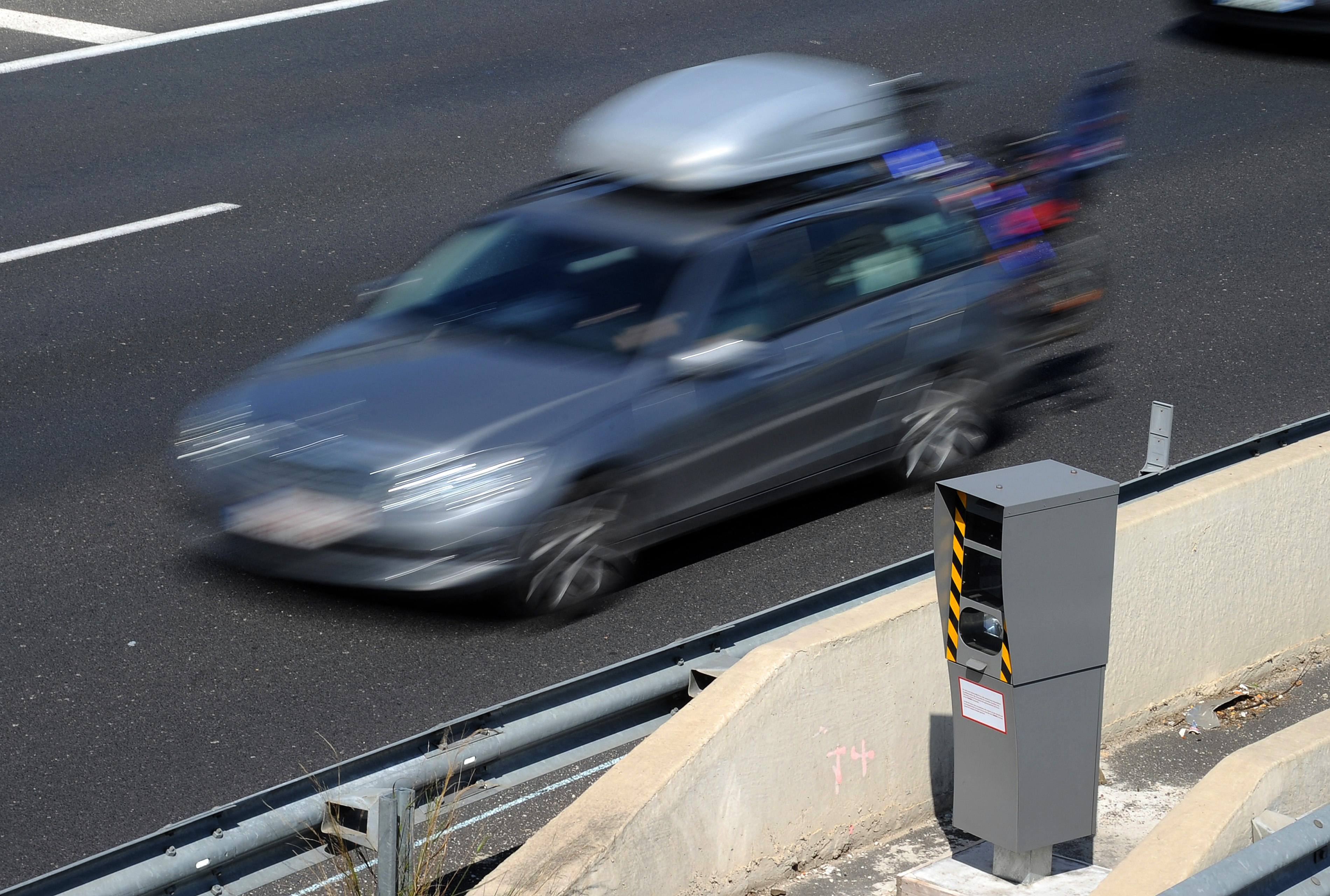 A picture taken on April 3, 2013 in Saint-Aunes-Odysseum shows motor vehicules driven in front of a radar on the A9 motorway. AFP PHOTO / PASCAL GUYOT (Photo by Pascal GUYOT / AFP) (Photo by PASCAL GUYOT/AFP via Getty Images)