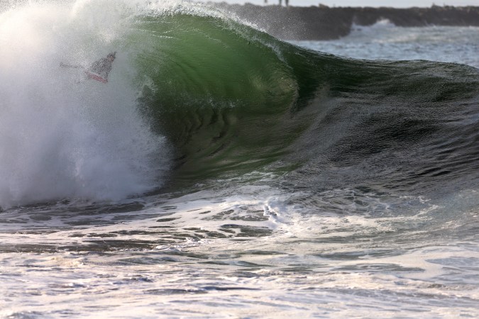 NEWPORT BEACH, CALIFORNIA - SEPTEMBER 04: A Bodyboarder rides a large wave at The Wedge during a south swell that brought large waves to Southern California beaches on September 04, 2023 in Newport Beach, California. The Wedge is well-known among surfers for its swell that reflects off a jetty and back into other swells in the wedge-shaped water between the beach and jetty to produce dangerously big surf in water that can be as shallow as three feet (Photo by Sean M. Haffey/Getty Images)