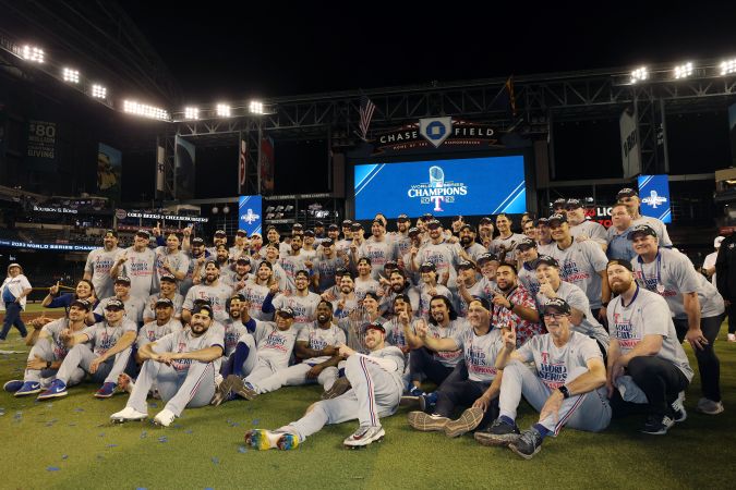 PHOENIX, ARIZONA - NOVEMBER 01: The Texas Rangers pose for photos after beating the Arizona Diamondbacks 5-0 in Game Five to win the World Series at Chase Field on November 01, 2023 in Phoenix, Arizona. (Photo by Christian Petersen/Getty Images)
