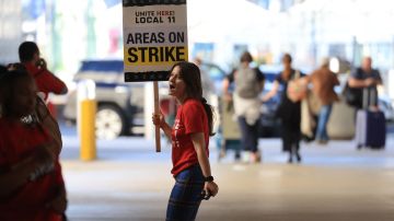 Airport workers strike at Los Angeles International Airport on November 21, 2023, in Los Angeles, as people travel ahead of the Thanksgiving holiday. (Photo by DAVID SWANSON / AFP) (Photo by DAVID SWANSON/AFP via Getty Images)