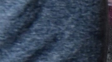 Pedestrians walk past a homeless man sleeping on the sidewalk on November 22, 2023 in Los Angeles, California, where skyrocketing rents in recent years has led to an increasing rise in the number of unhoused people. Some 75,500 people live on the streets of Los Angeles and its sprawling suburbs, according to a January survey. The figure is up 70 percent since 2015, in a city where sometimes shocking levels of inequality are on daily display. (Photo by Frederic J. BROWN / AFP) (Photo by FREDERIC J. BROWN/AFP via Getty Images)